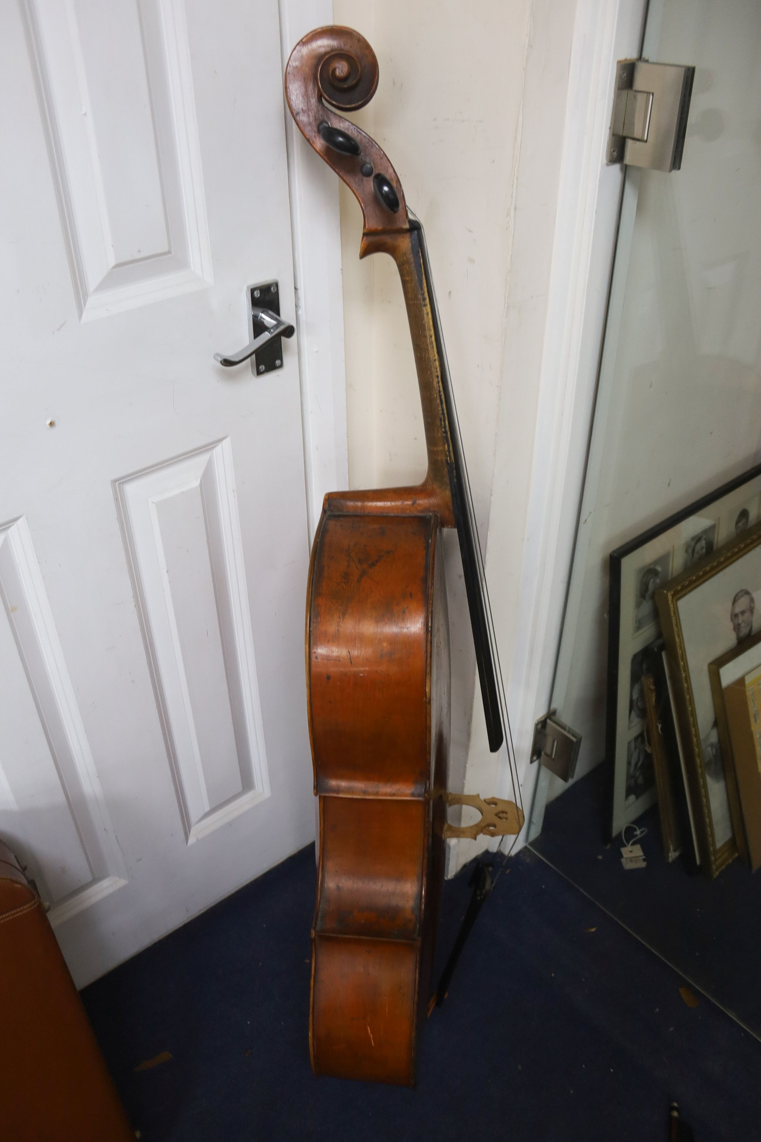 Early 20th century German cello and bow, the back measuring 75cm excluding the button
